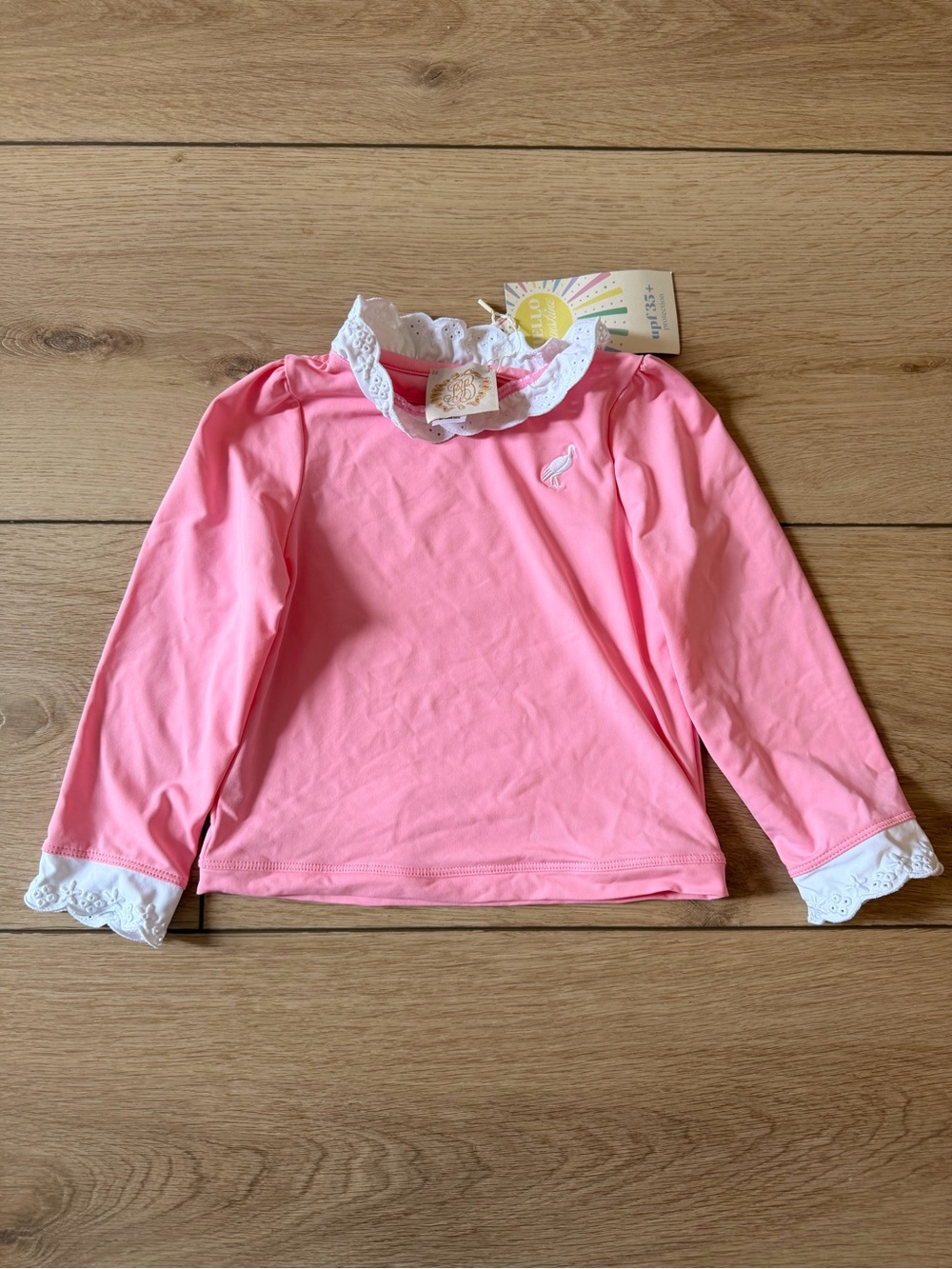 The Beaufort Bonnet Company Pink Kids Rashguard with White Lace Trim
